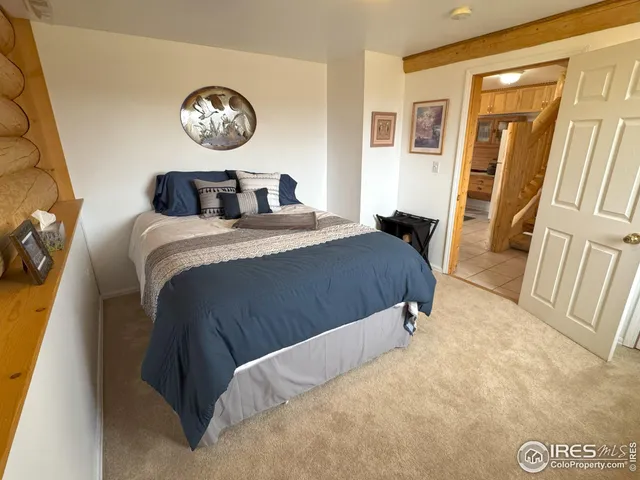 a bedroom with a bed and a table