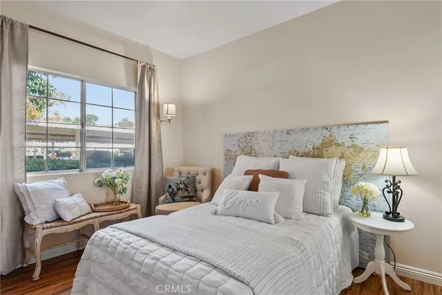 a bedroom with a bed and a window