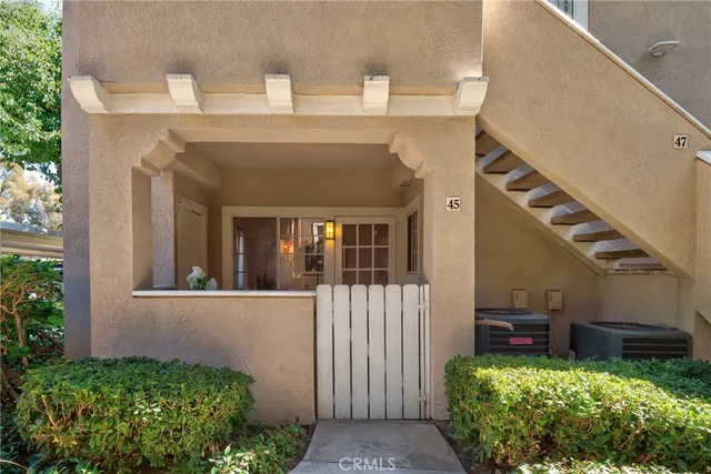a view of a house with a flower garden