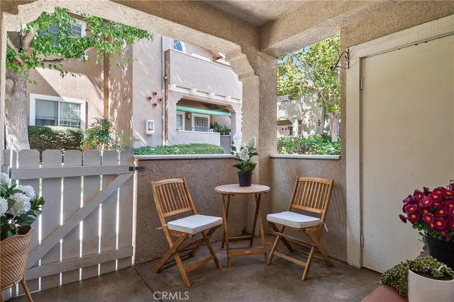 a view of a two chairs in the patio