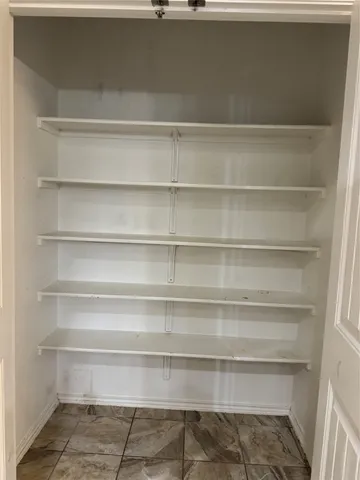 a bathroom with a shower sink vanity and mirror