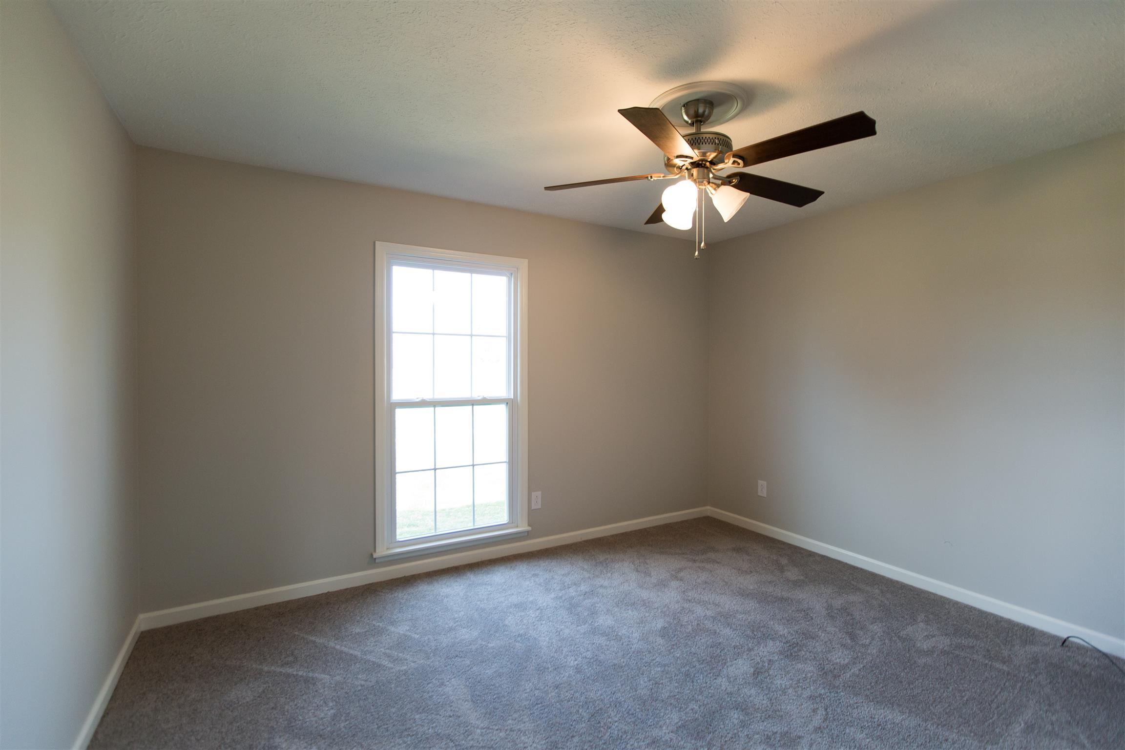 6339 Gum Station Road Springfield, TN 37172 - Photo 11 of 21 an empty room with a window and a fan