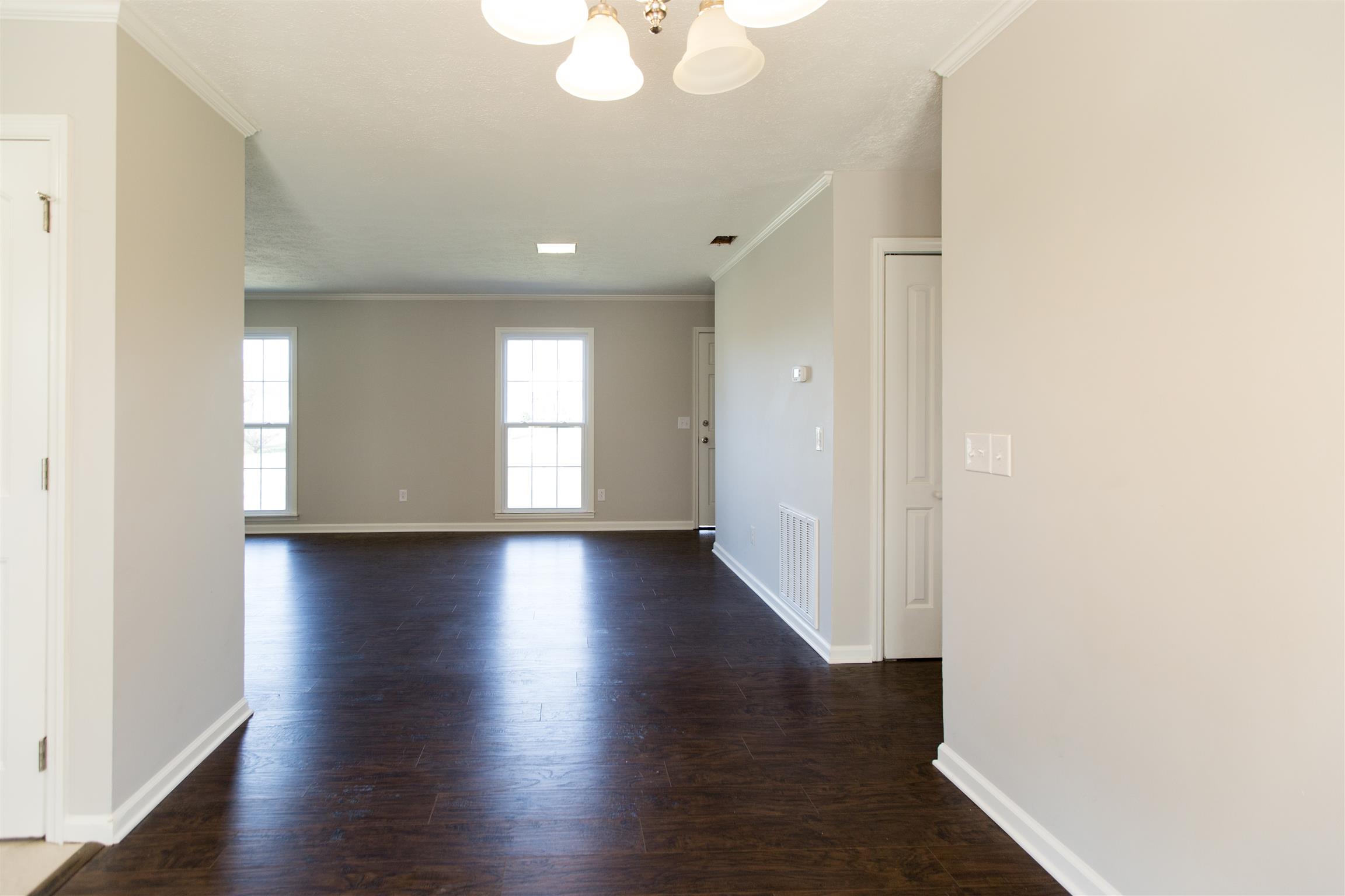 6339 Gum Station Road Springfield, TN 37172 - Photo 3 of 21 an empty room with wooden floor and windows
