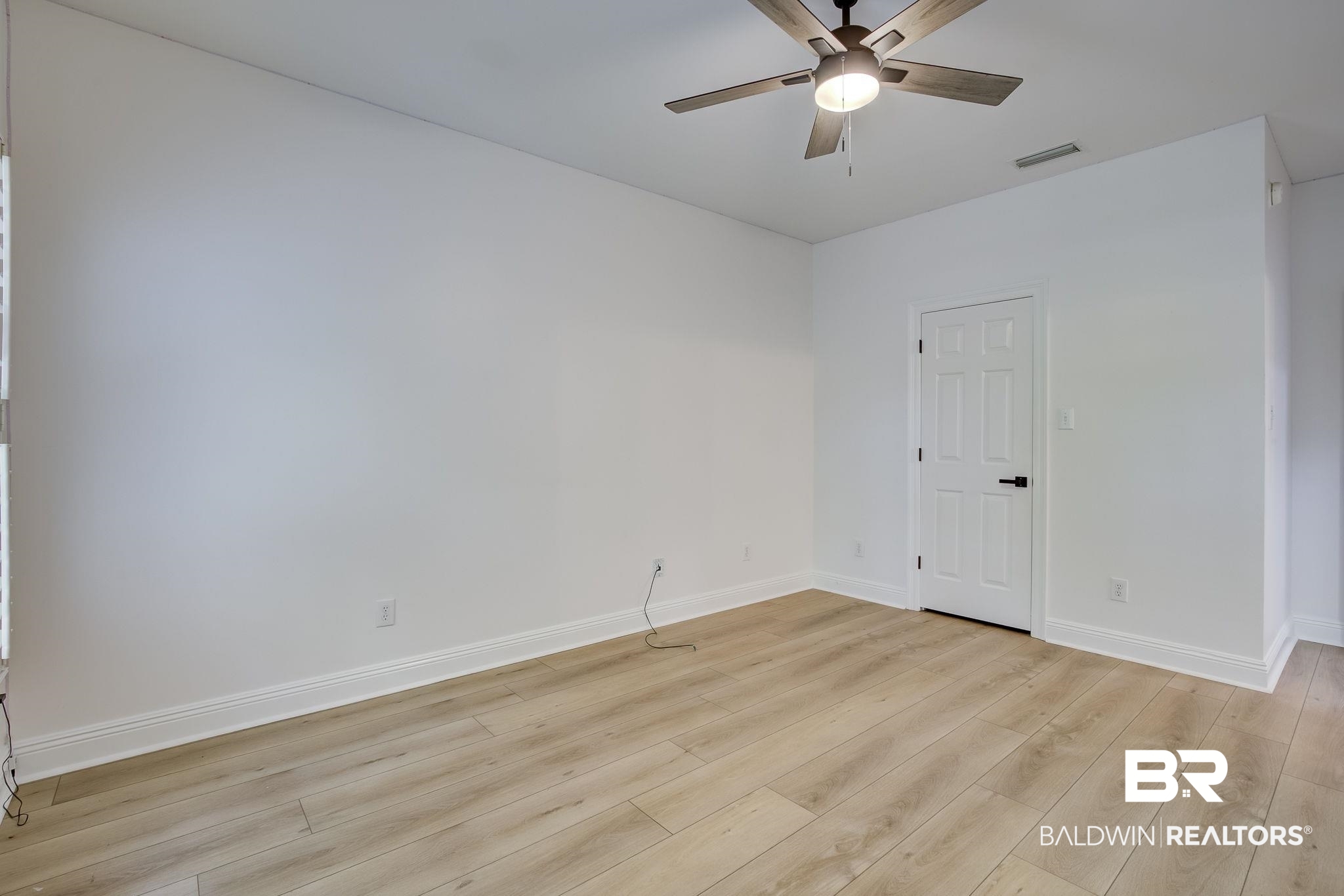 105 High Pines Ridge Fairhope, AL 36532 - Photo 70 of 97 Spare room featuring light wood-type flooring, a ceiling fan, and baseboards
