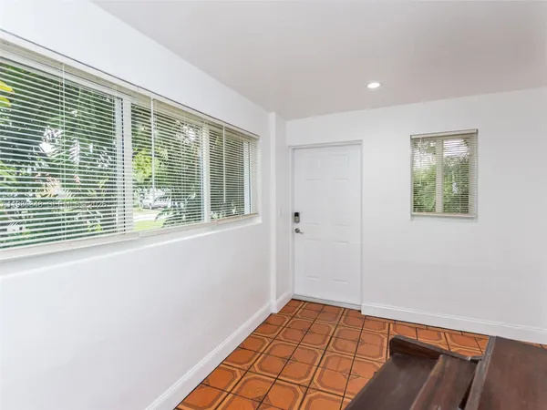 a view of an empty room and window