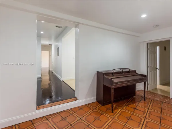 a view of a hallway with front door