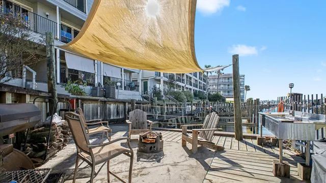 a view of a balcony with chairs