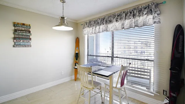 a view of a dining room with furniture window and outside view