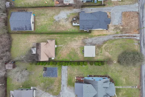 an aerial view of residential house with outdoor space
