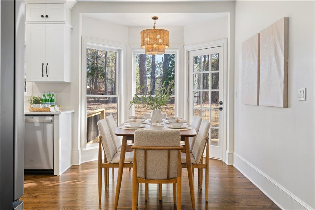11125 Linbrook Lane Johns Creek, GA 30097 - Photo 16 of 44 a view of a dining room with furniture window and wooden floor