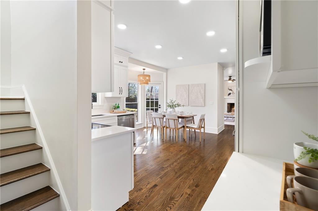 11125 Linbrook Lane Johns Creek, GA 30097 - Photo 18 of 44 a view of dining room with furniture and wooden floor