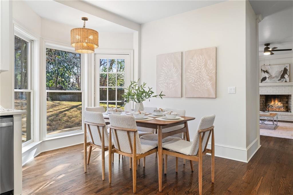 11125 Linbrook Lane Johns Creek, GA 30097 - Photo 22 of 44 a view of a dining room with furniture window and wooden floor