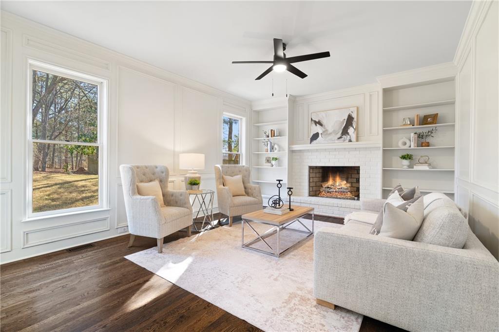 11125 Linbrook Lane Johns Creek, GA 30097 - Photo 24 of 44 a living room with furniture and a fireplace