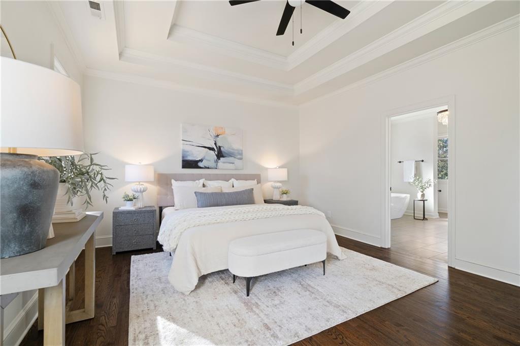11125 Linbrook Lane Johns Creek, GA 30097 - Photo 28 of 44 a bedroom with a bed and wooden floor