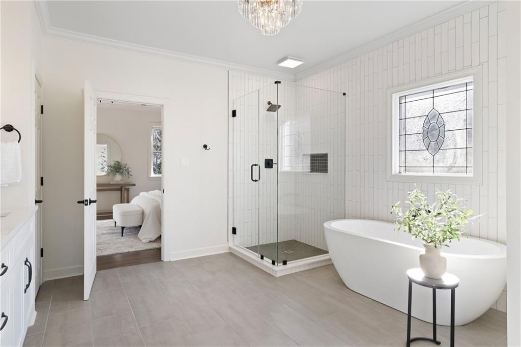 11125 Linbrook Lane Johns Creek, GA 30097 - Photo 30 of 44 a living room with furniture and a chandelier