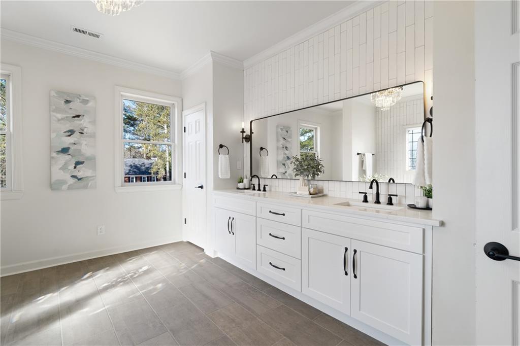 11125 Linbrook Lane Johns Creek, GA 30097 - Photo 31 of 44 a spacious bathroom with 2 sink and a mirror