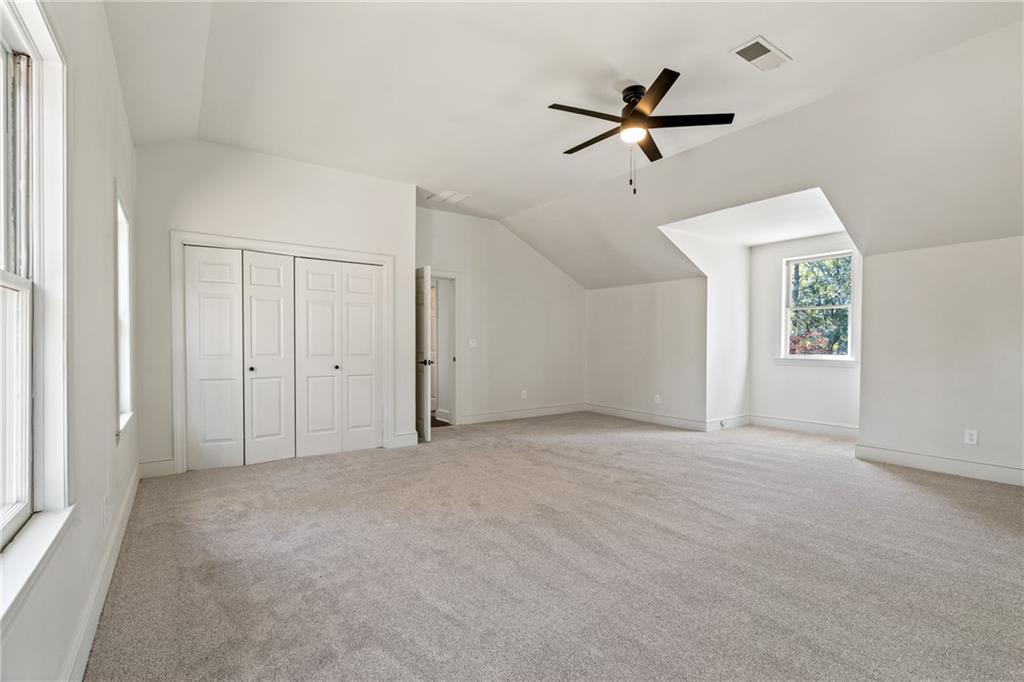 11125 Linbrook Lane Johns Creek, GA 30097 - Photo 38 of 44 an empty room with fan and windows