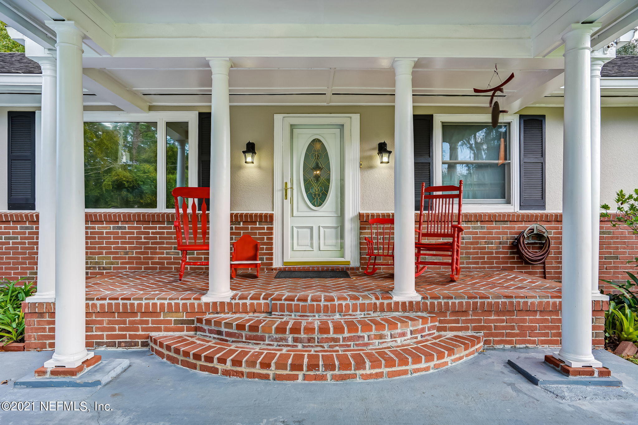 12957 Mandarin Road Jacksonville, FL 32223 - Photo 13 of 83 a front view of a house with large windows
