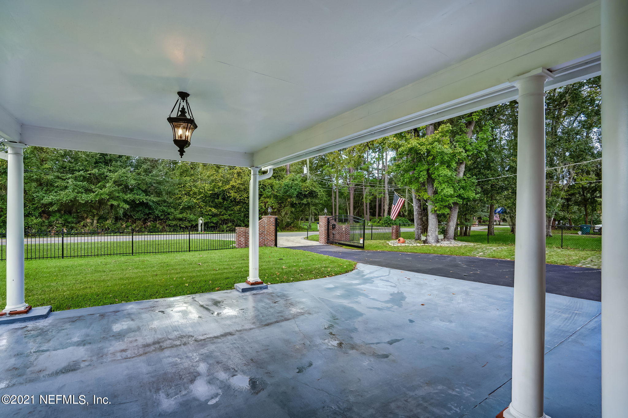 12957 Mandarin Road Jacksonville, FL 32223 - Photo 17 of 83 a view of a house with backyard and porch