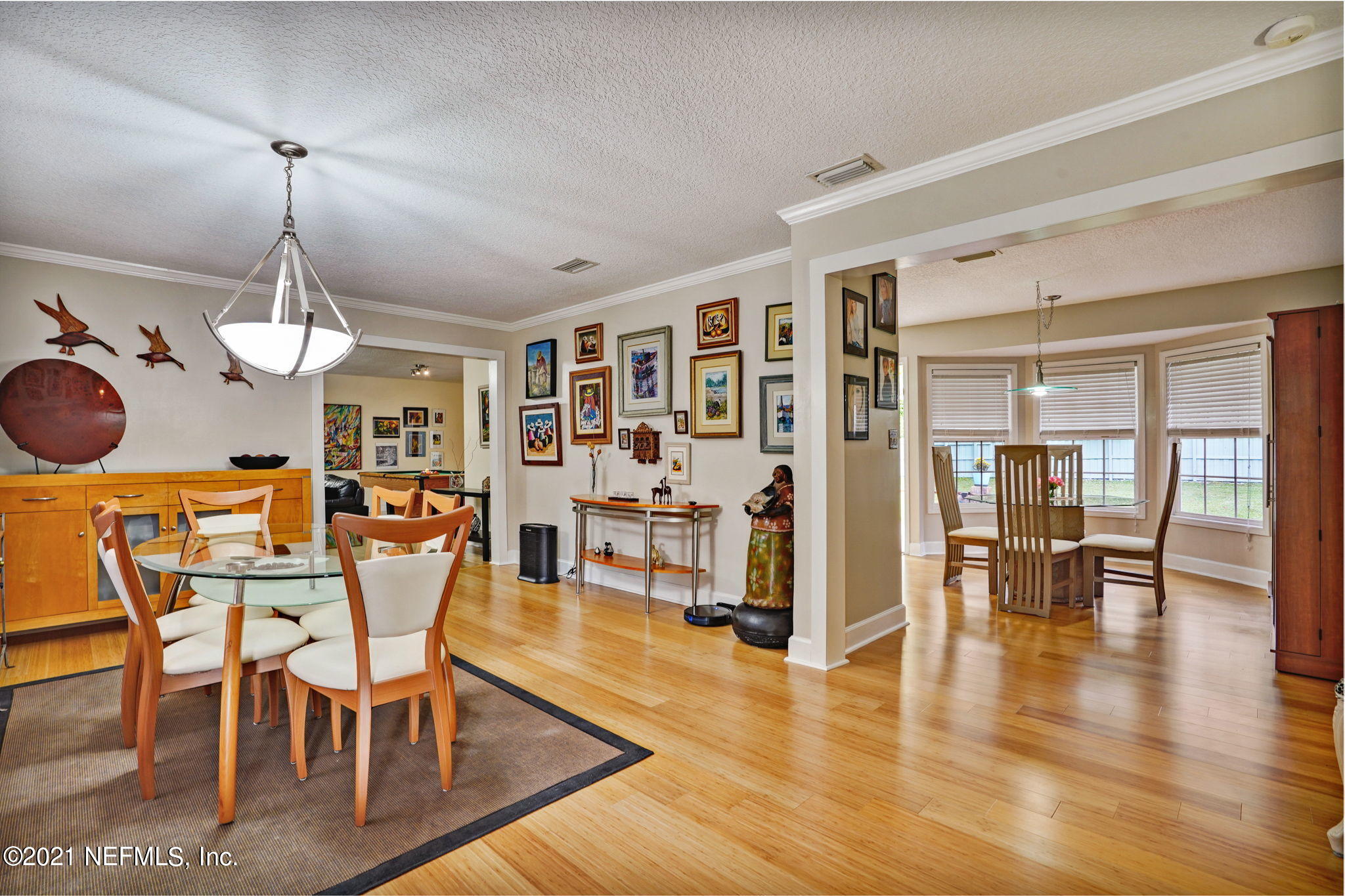 12957 Mandarin Road Jacksonville, FL 32223 - Photo 25 of 83 a view of dining room and hall with wooden floor