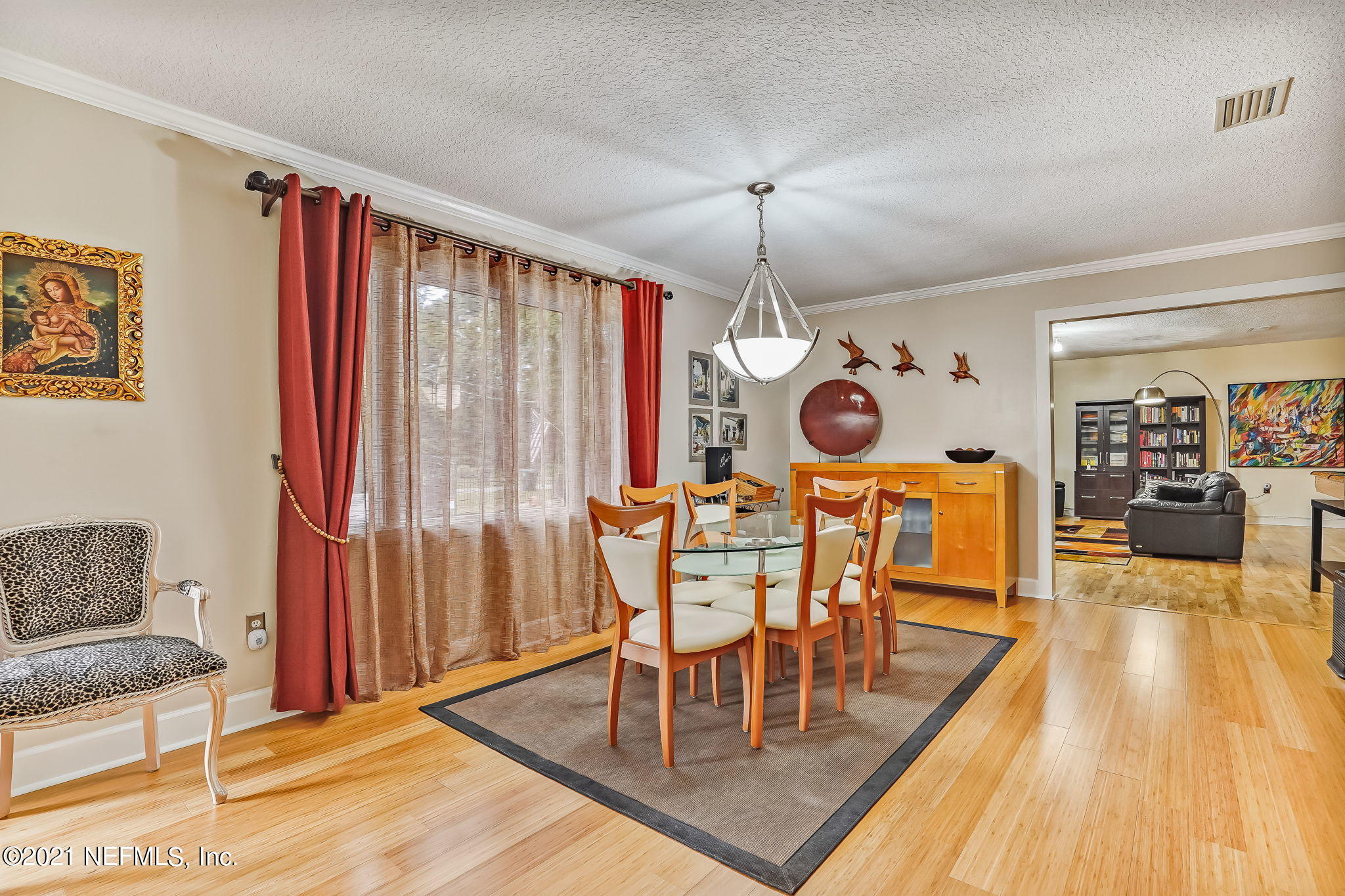 12957 Mandarin Road Jacksonville, FL 32223 - Photo 26 of 83 a view of a dining room with furniture and wooden floor