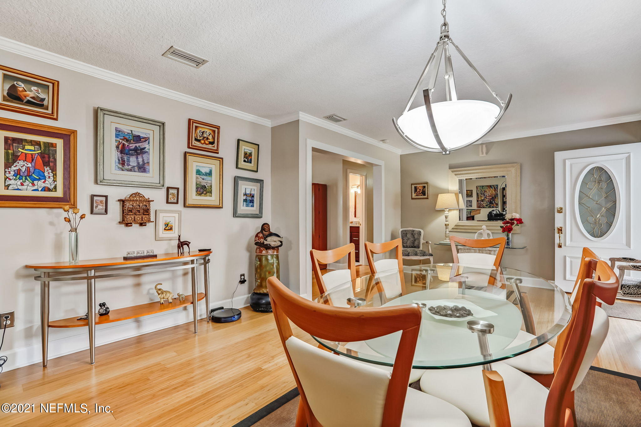 12957 Mandarin Road Jacksonville, FL 32223 - Photo 28 of 83 a view of a dining room with furniture a chandelier and wooden floor