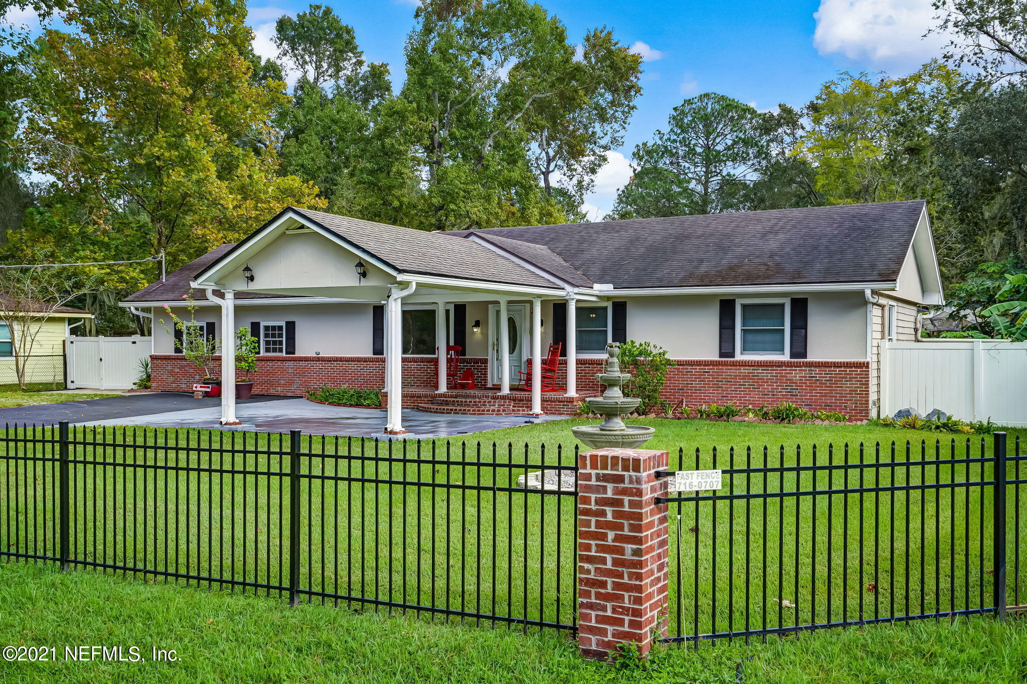 12957 Mandarin Road Jacksonville, FL 32223 - Photo 3 of 83 a front view of a house with a garden