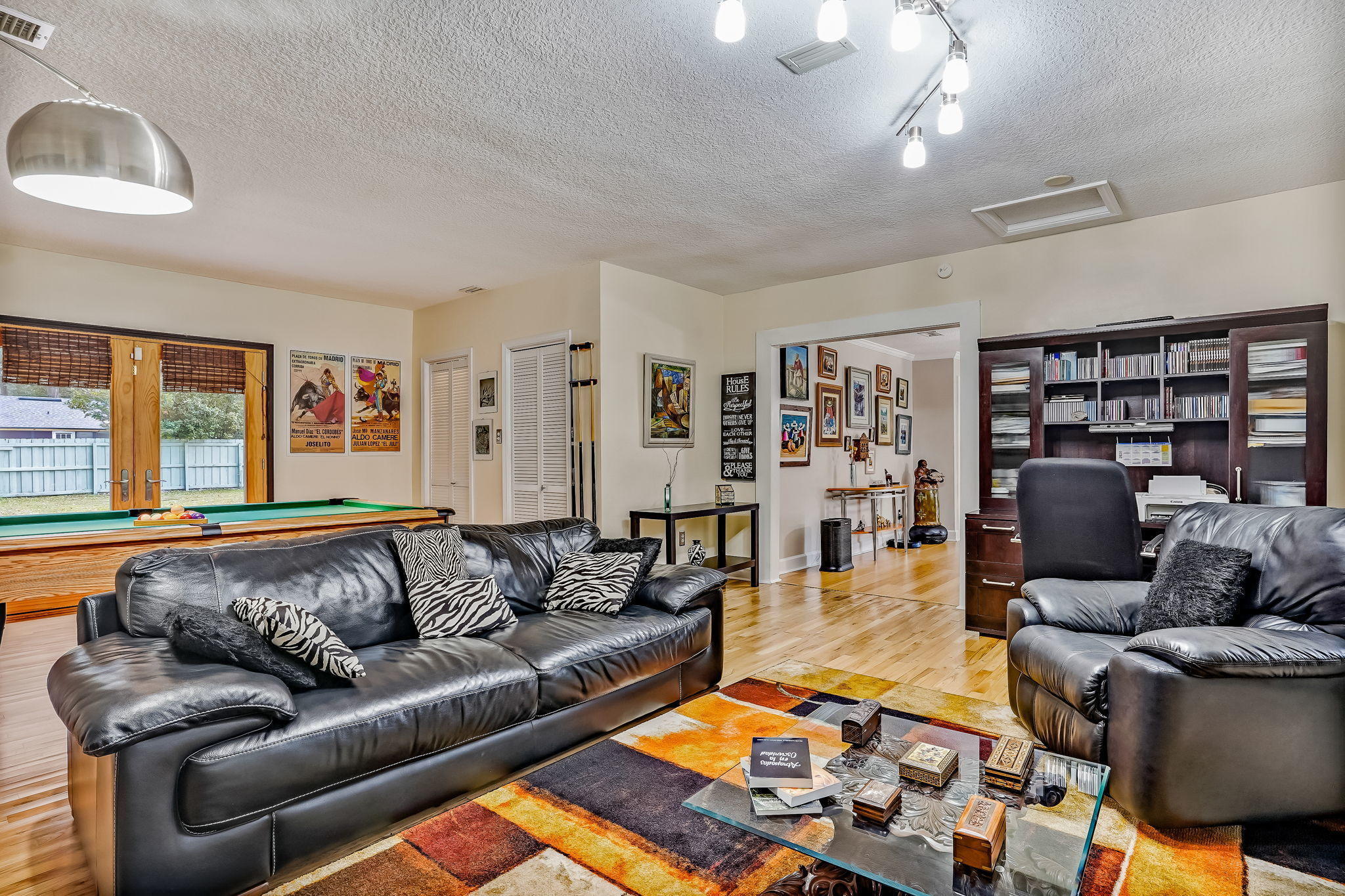 12957 Mandarin Road Jacksonville, FL 32223 - Photo 32 of 83 a living room with furniture and a book shelf