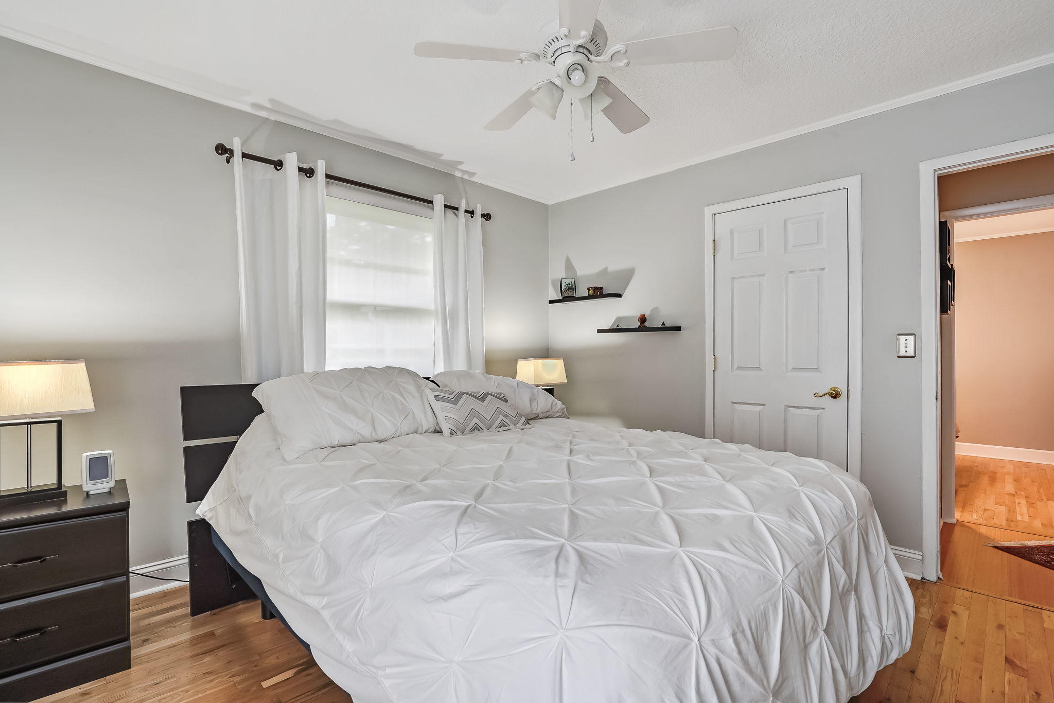 12957 Mandarin Road Jacksonville, FL 32223 - Photo 50 of 83 a bedroom with a bed and a chandelier