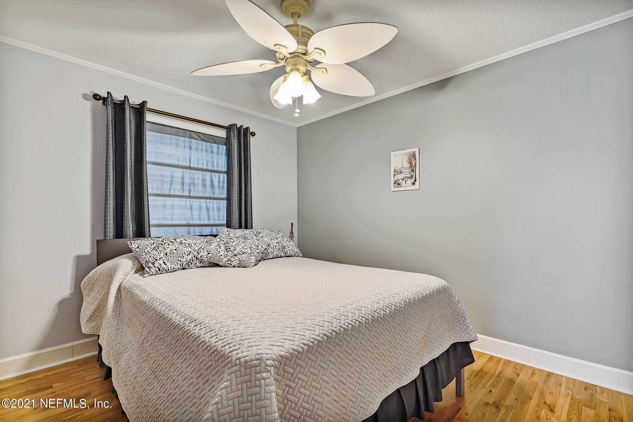 12957 Mandarin Road Jacksonville, FL 32223 - Photo 56 of 83 a bedroom with a bed and a chandelier