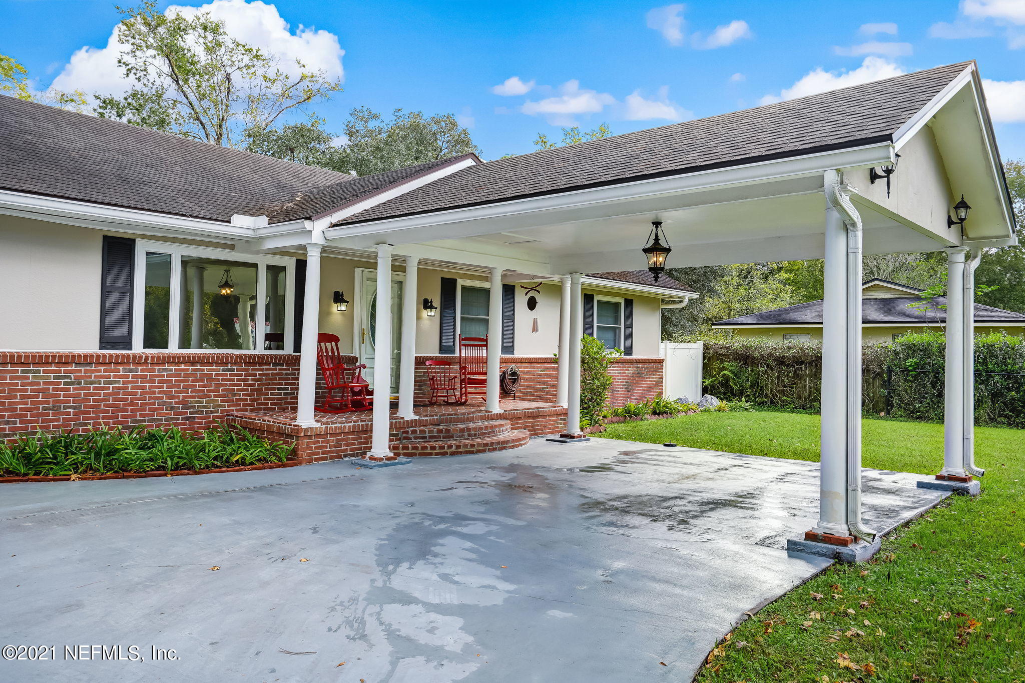12957 Mandarin Road Jacksonville, FL 32223 - Photo 7 of 83 a view of a house with porch and garden