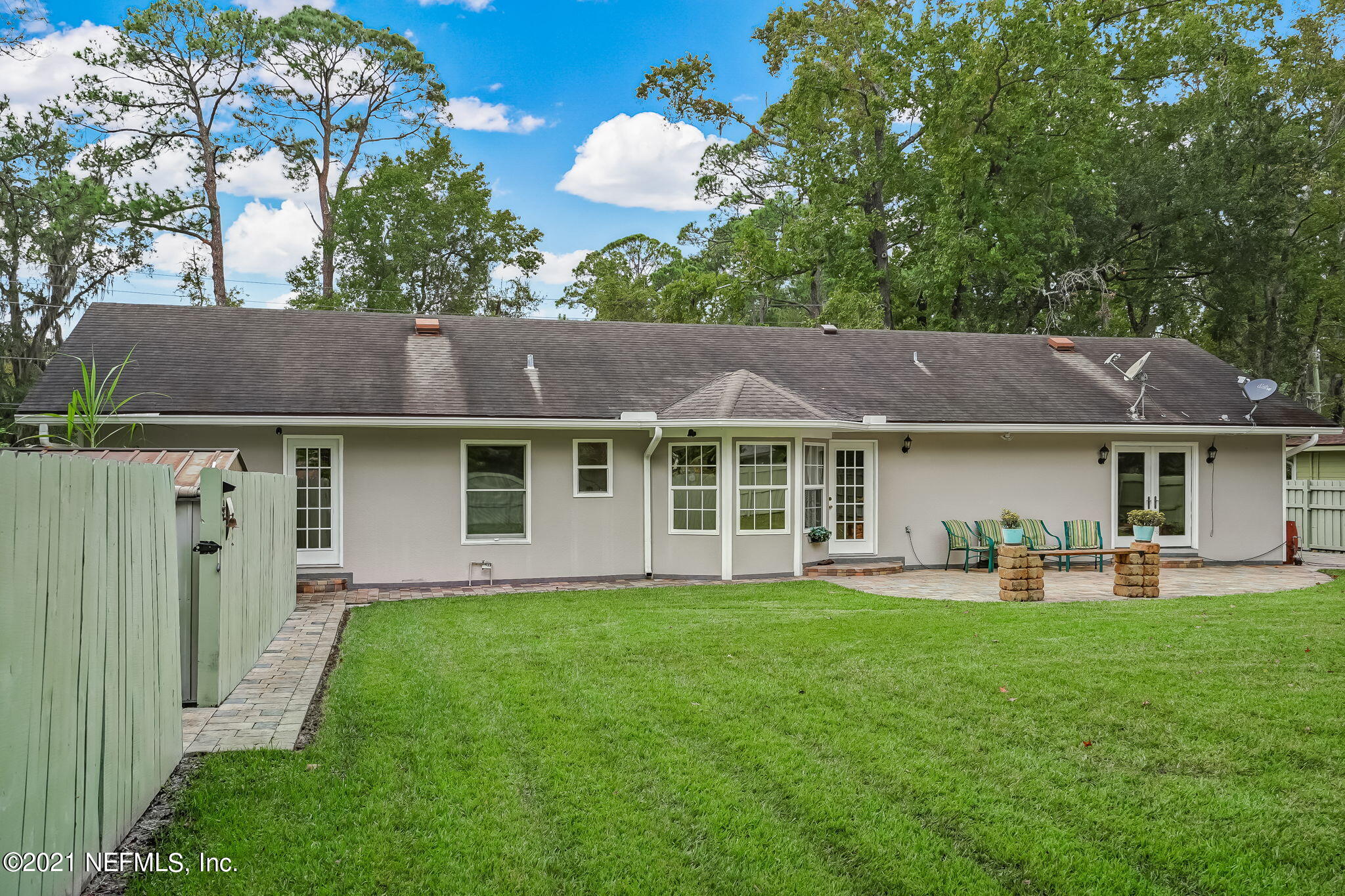 12957 Mandarin Road Jacksonville, FL 32223 - Photo 72 of 83 a front view of a house with a yard and trees