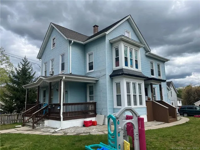 a front view of house with yard and front view of a house
