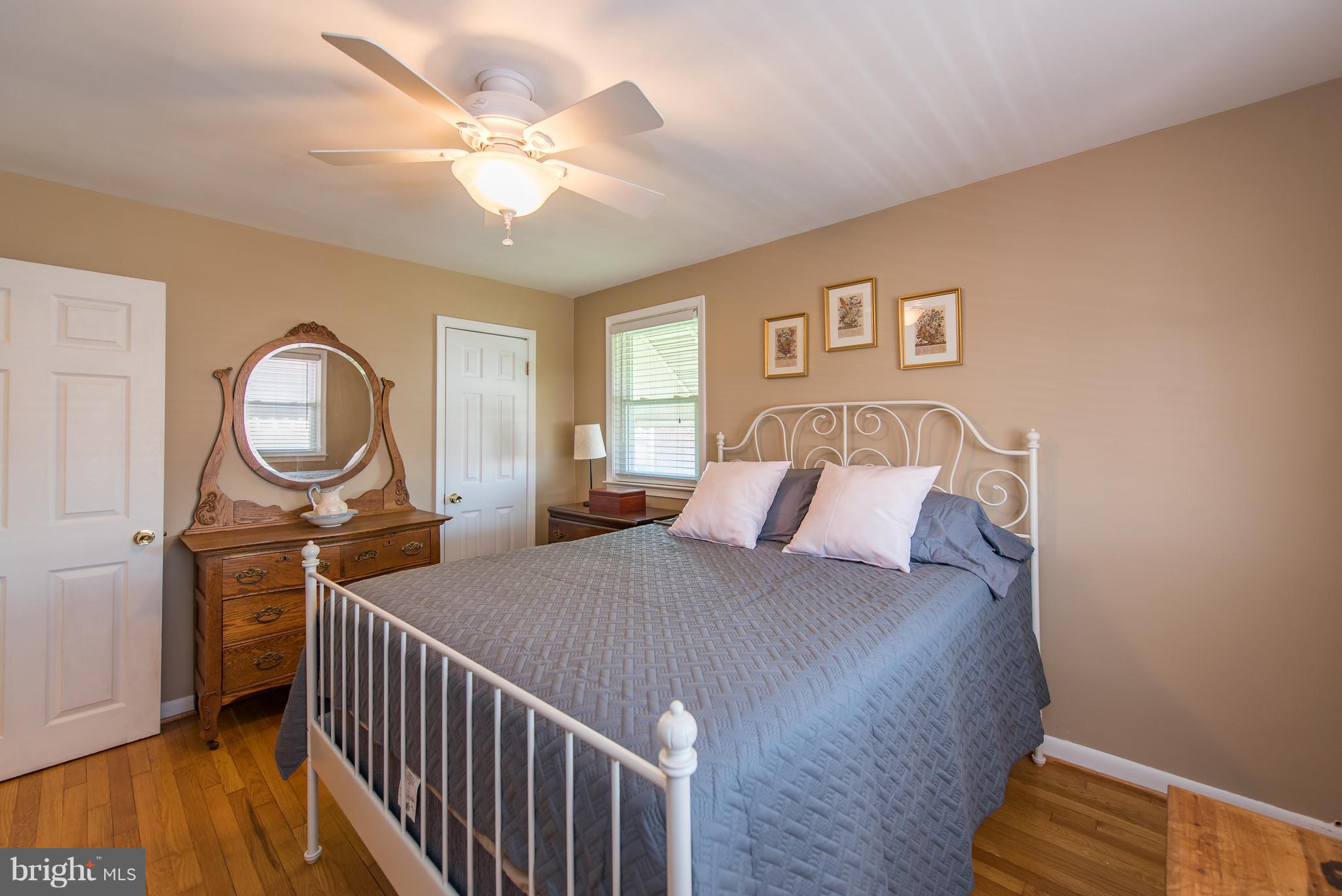 2223 Redthorn Road Baltimore, MD 21220 - Photo 14 of 30 a bedroom with a bed a mirror and a window