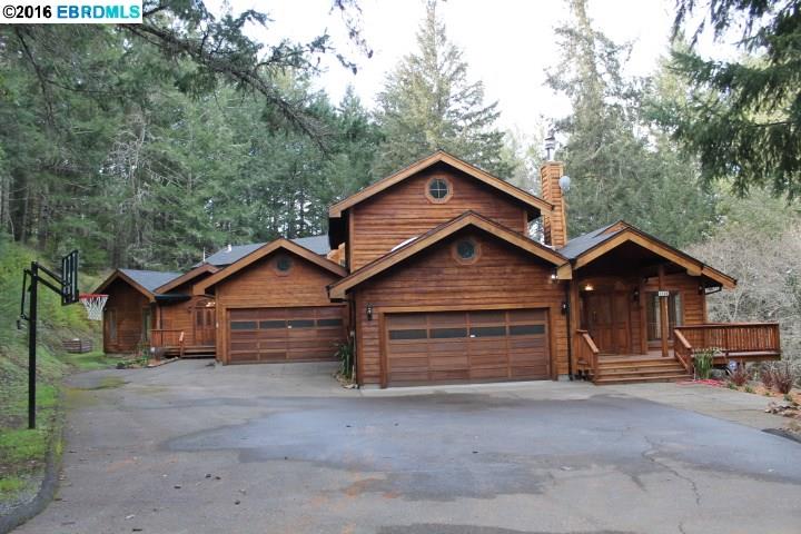a view of a house with a garage and balcony