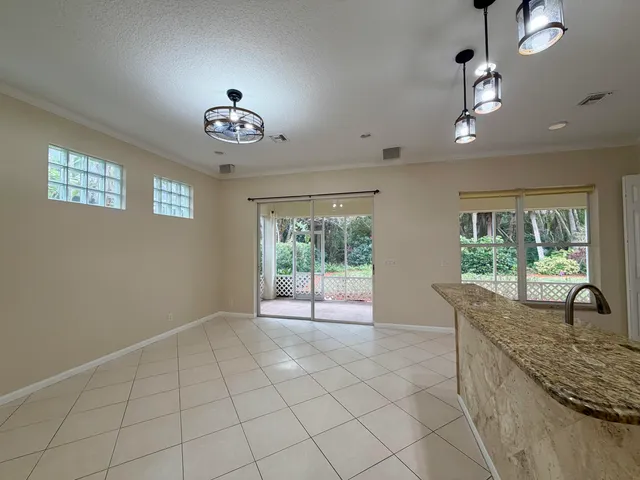 a kitchen with a sink counter top space cabinets and stainless steel appliances