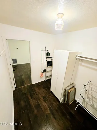 a view of a livingroom with wooden floor