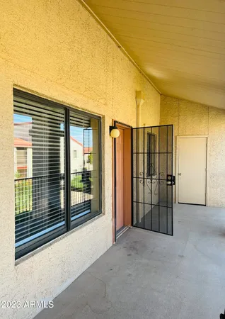 a view of empty room with floor to ceiling window