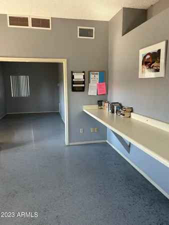 a room with furniture and air conditioner vent