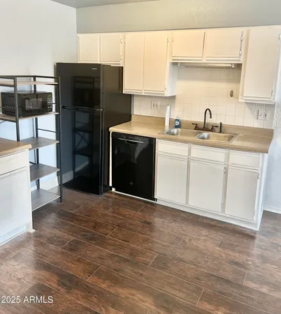 a kitchen with stainless steel appliances a refrigerator and a sink