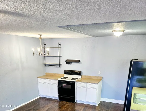 a kitchen with a stove and a refrigerator
