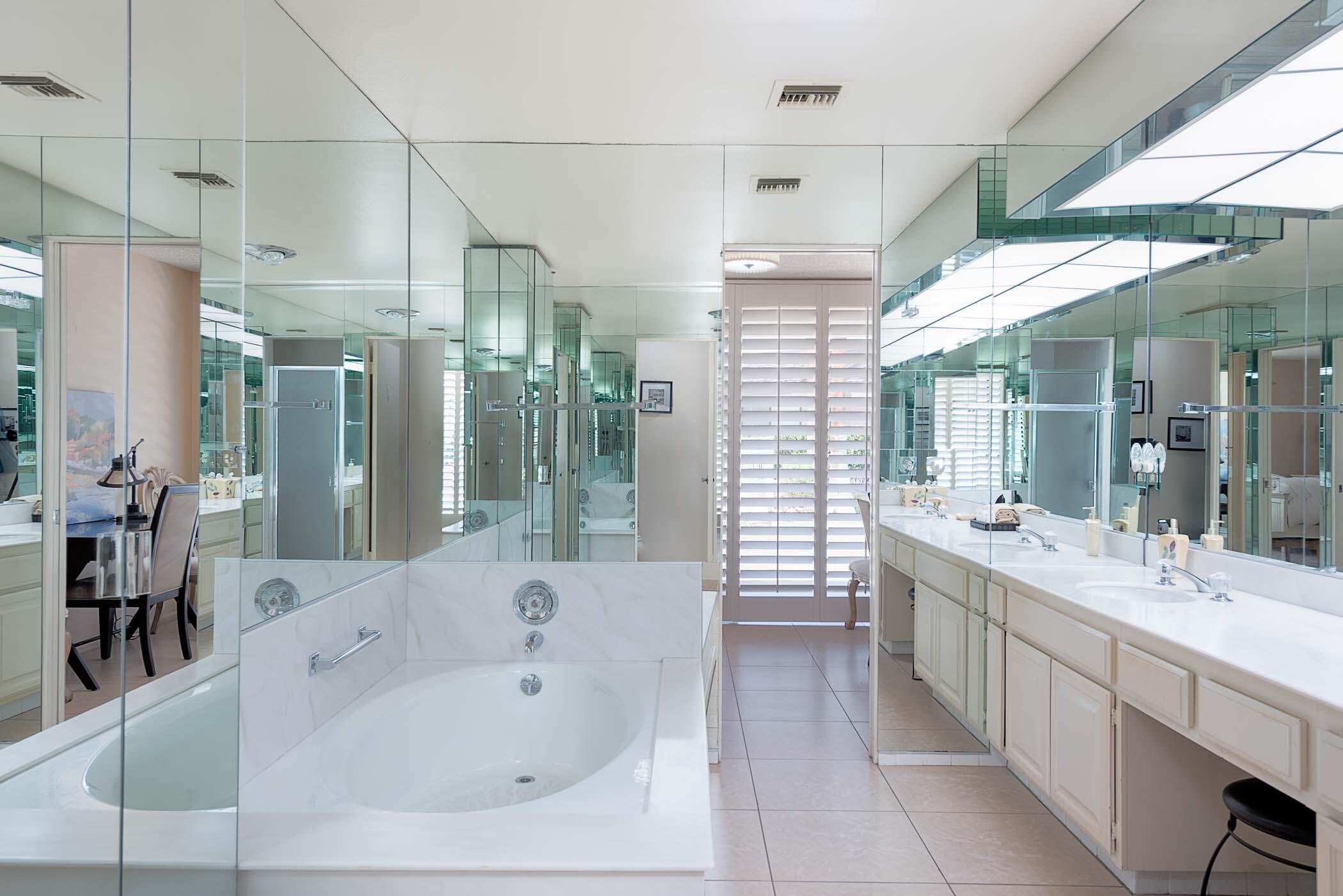 8 Tulane Court Rancho Mirage, CA 92270 - Photo 13 of 31 a large bathroom with a large tub and sink