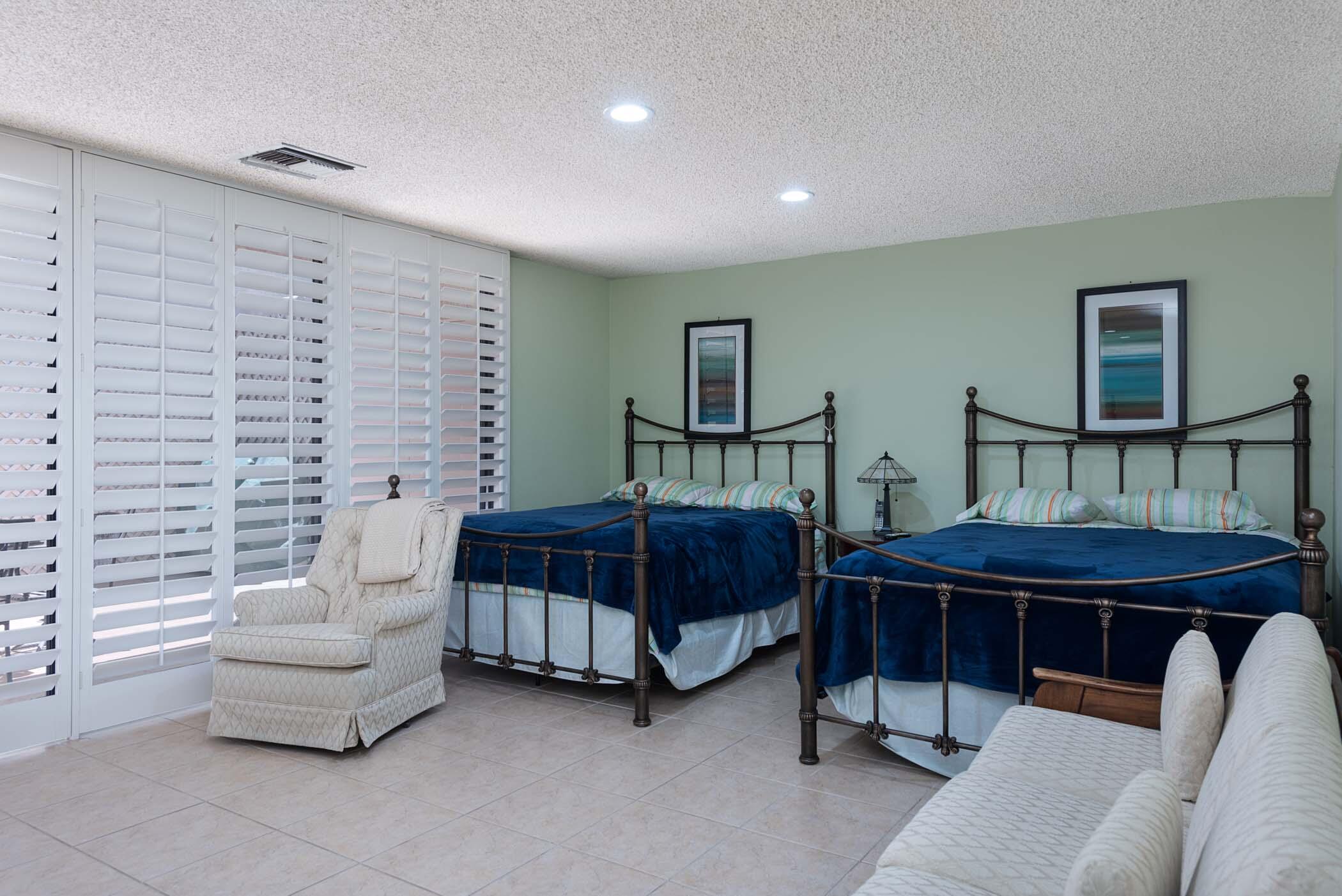 8 Tulane Court Rancho Mirage, CA 92270 - Photo 15 of 31 a bedroom with furniture and a couch