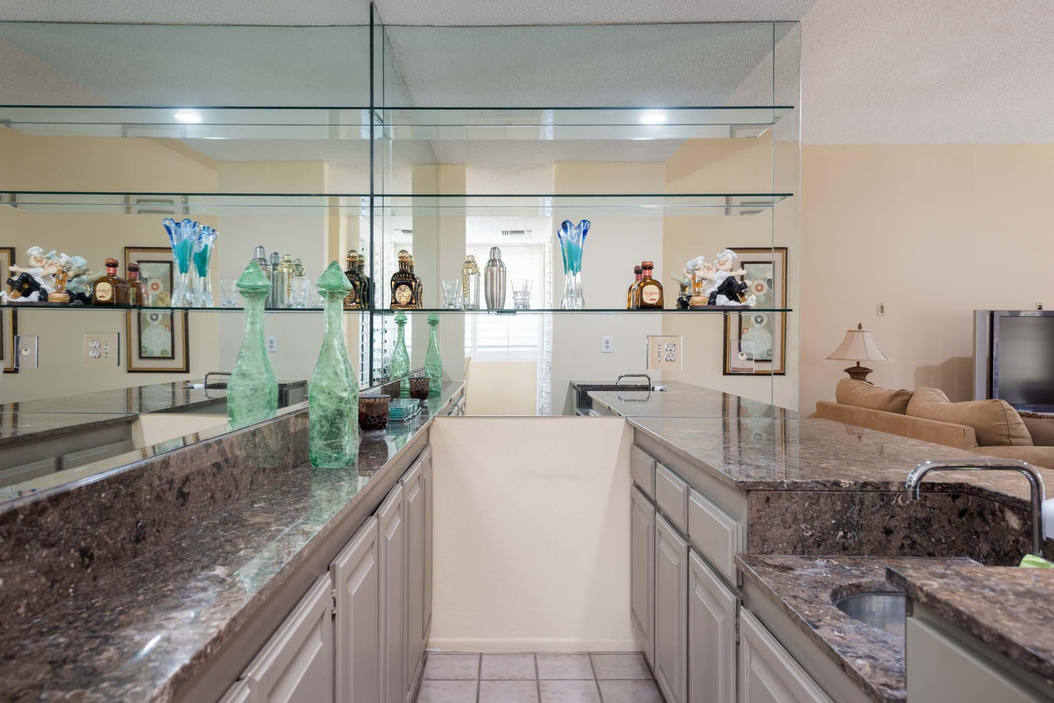 8 Tulane Court Rancho Mirage, CA 92270 - Photo 25 of 31 a kitchen with stainless steel appliances granite countertop a sink stove and cabinets