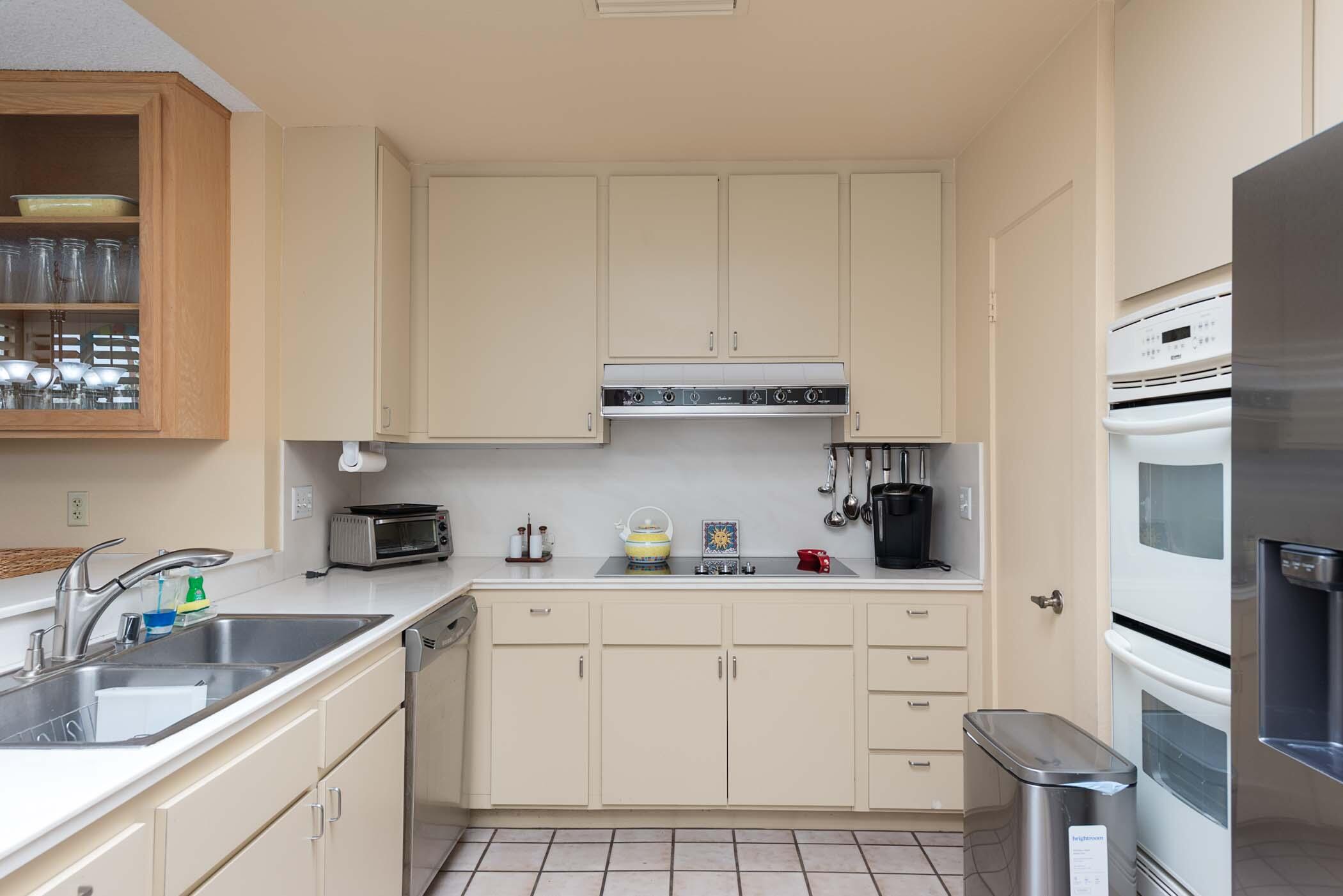 8 Tulane Court Rancho Mirage, CA 92270 - Photo 26 of 31 a kitchen with stainless steel appliances a sink stove and cabinets