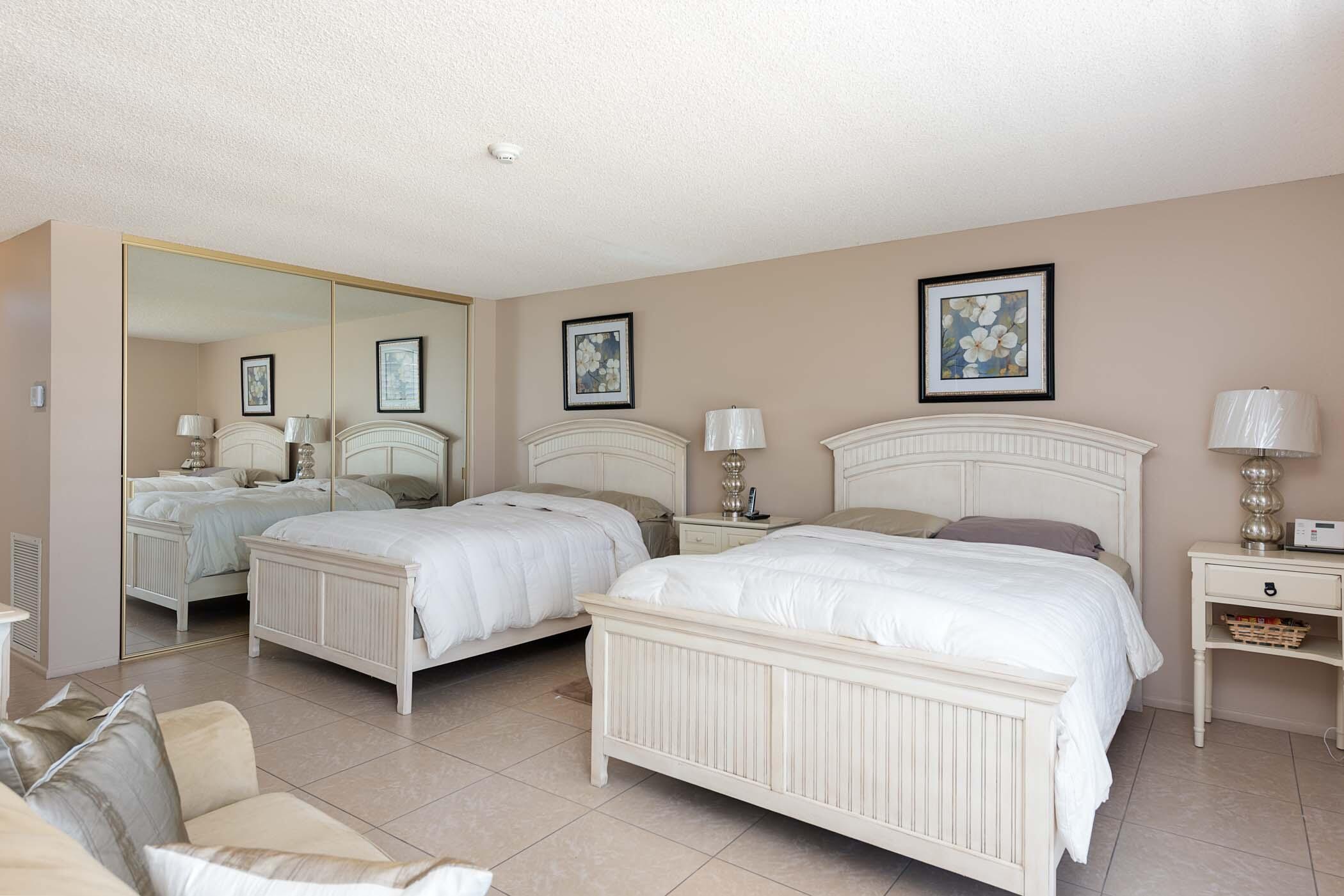 8 Tulane Court Rancho Mirage, CA 92270 - Photo 27 of 31 a bedroom with two beds and painting on the wall