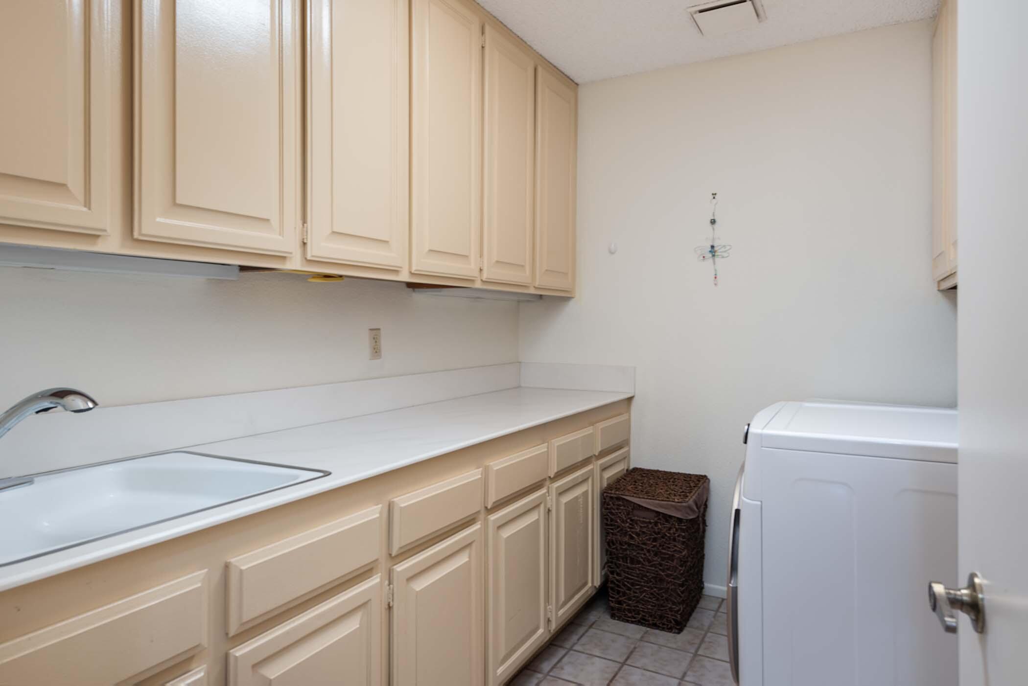 8 Tulane Court Rancho Mirage, CA 92270 - Photo 29 of 31 a utility room with sink dryer and washer