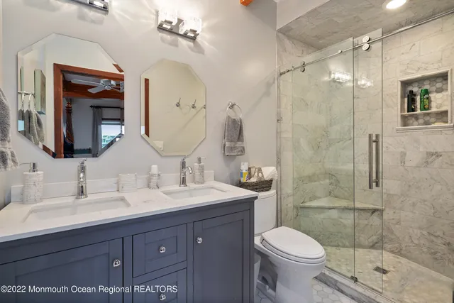 a view of a terrace with lawn chairs