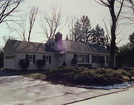 5 Juniper Road Westport, CT 06880 - Photo 1 of 1 a front view of house with yard and trees