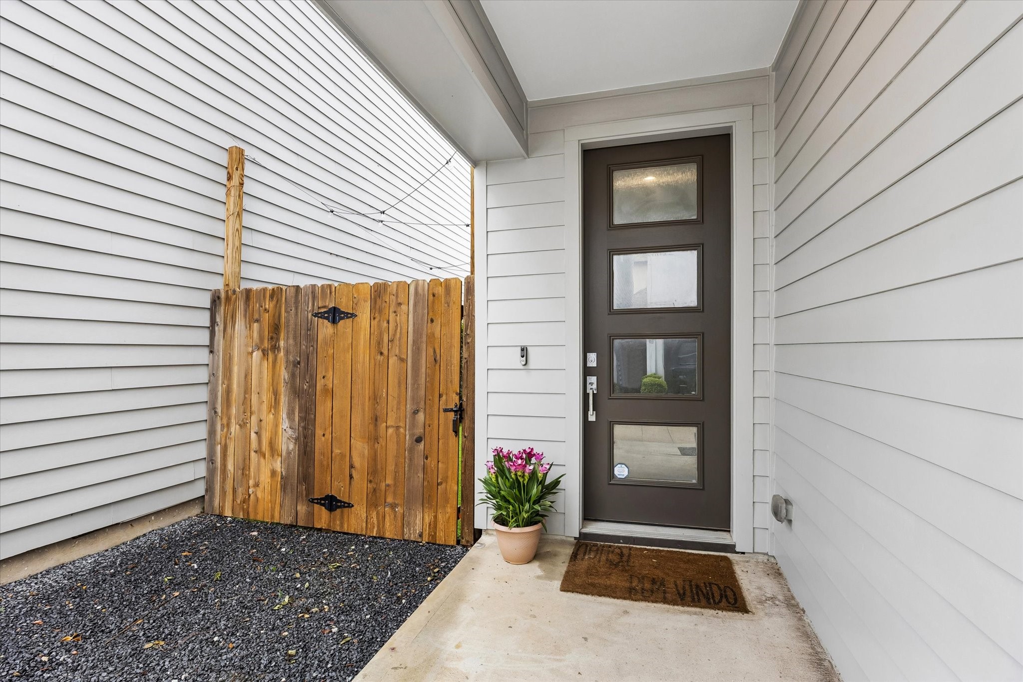 1310 Hussion Street Houston, TX 77003 - Photo 4 of 34 Lovely modern front entrance with a sleek, dark door featuring frosted glass panels.